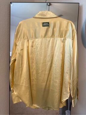 Daily Drills Satin Button-Front Top in Light Yellow with Green Label